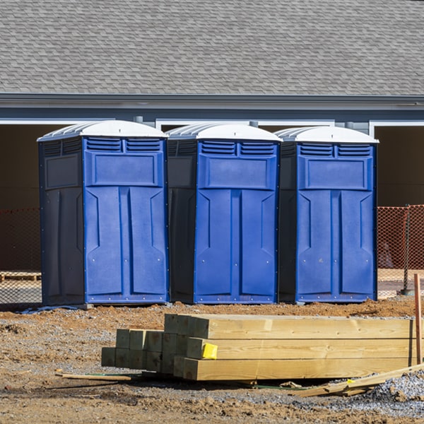 what is the cost difference between standard and deluxe portable restroom rentals in Holt Michigan